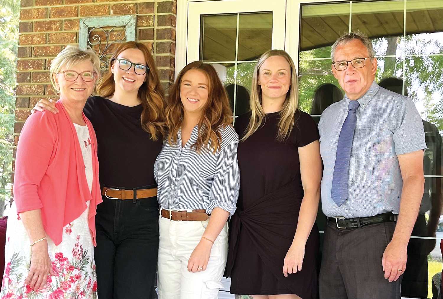 Jacqui Beckett, at far left, with her daughters Bre, Kari, and Aimee, and her husband Garry.